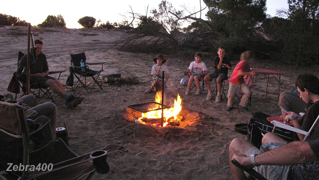 03-The kids get ready for dinner around the campfire at Coburns Pines.jpg